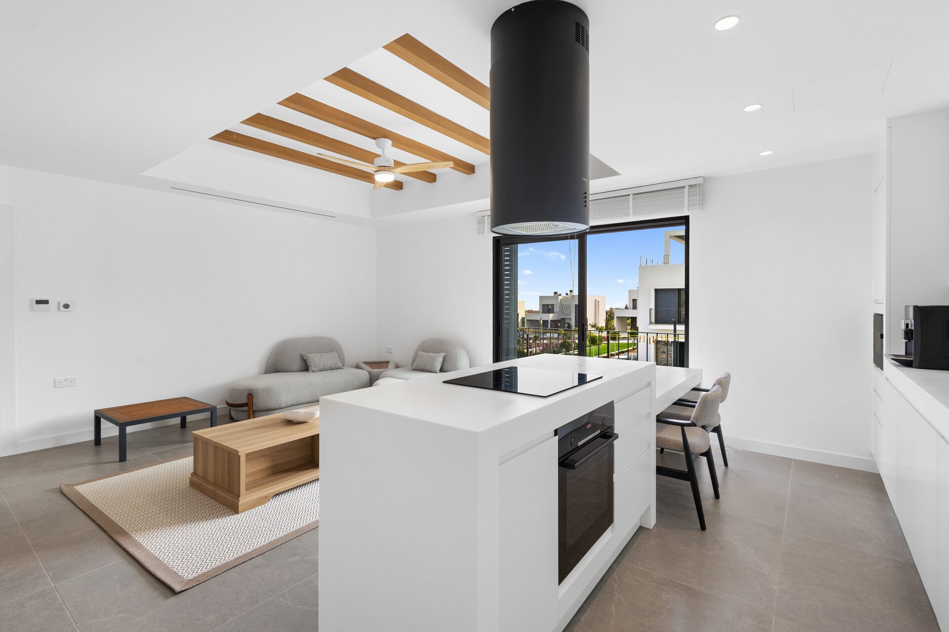Kitchen with island and integrated appliances